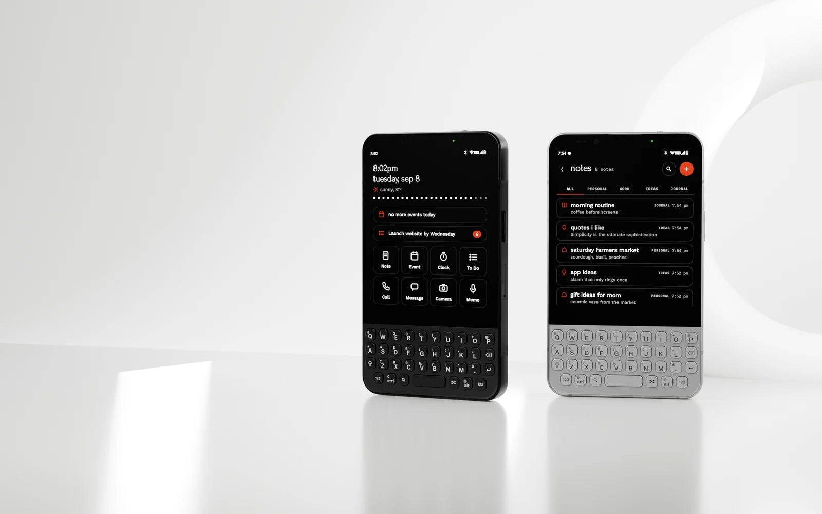 Minimal Phone 2 in Onyx and Pearl in a bright white sculptural setting